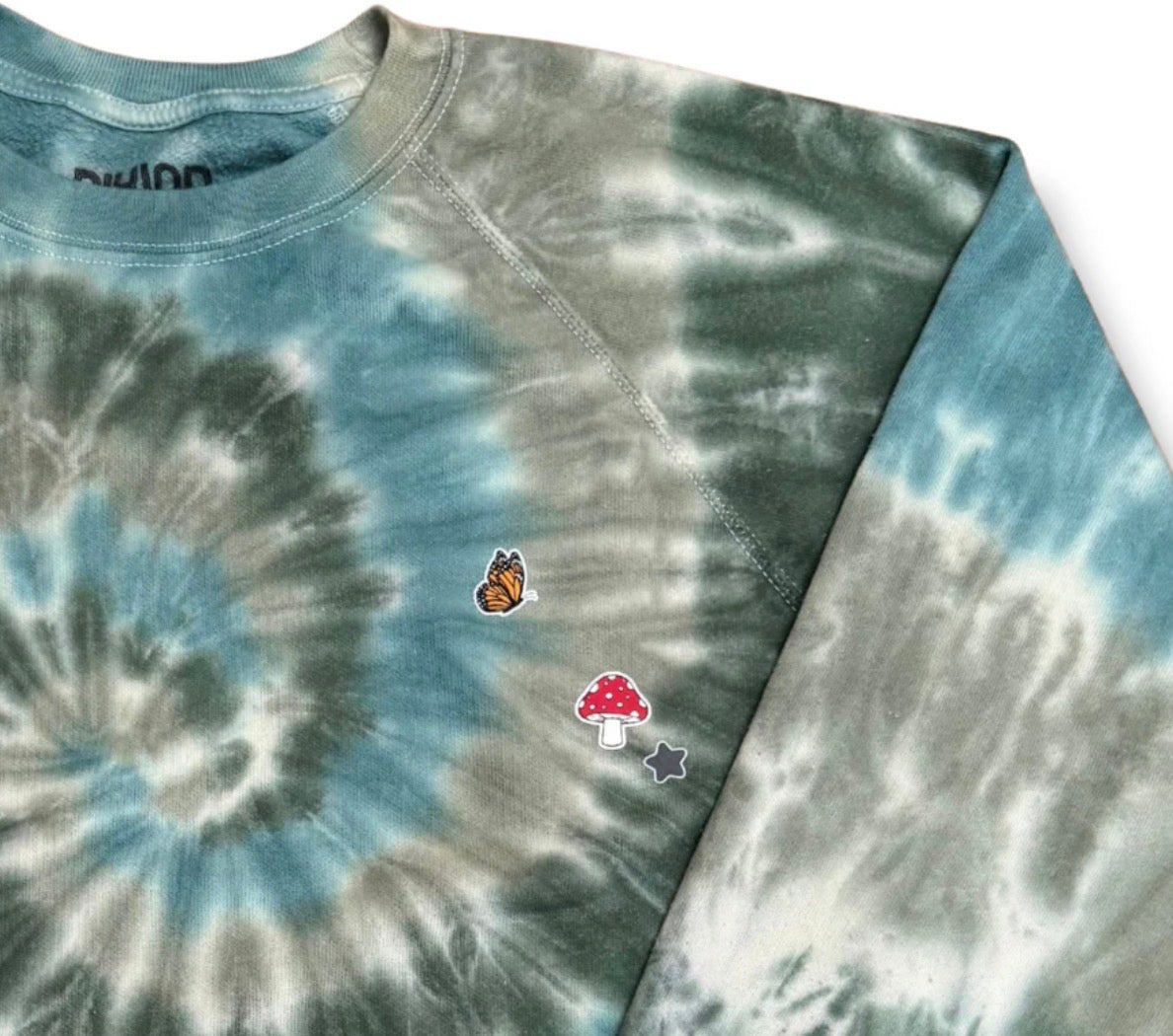 Tie dye sweater with printed stickers